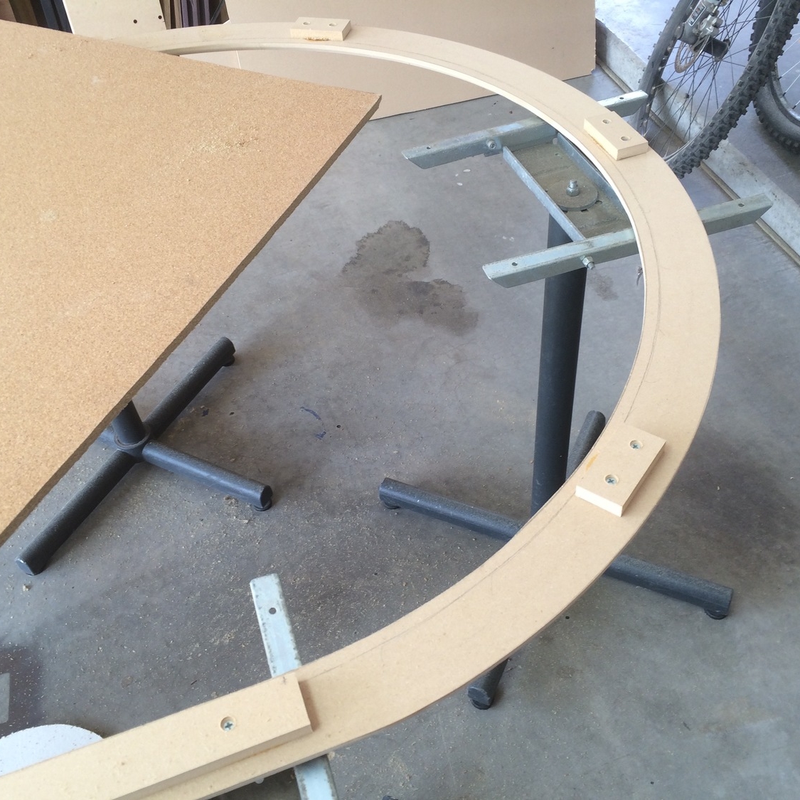 Frame cut with jigsaw, has blocks to hold cork board in place