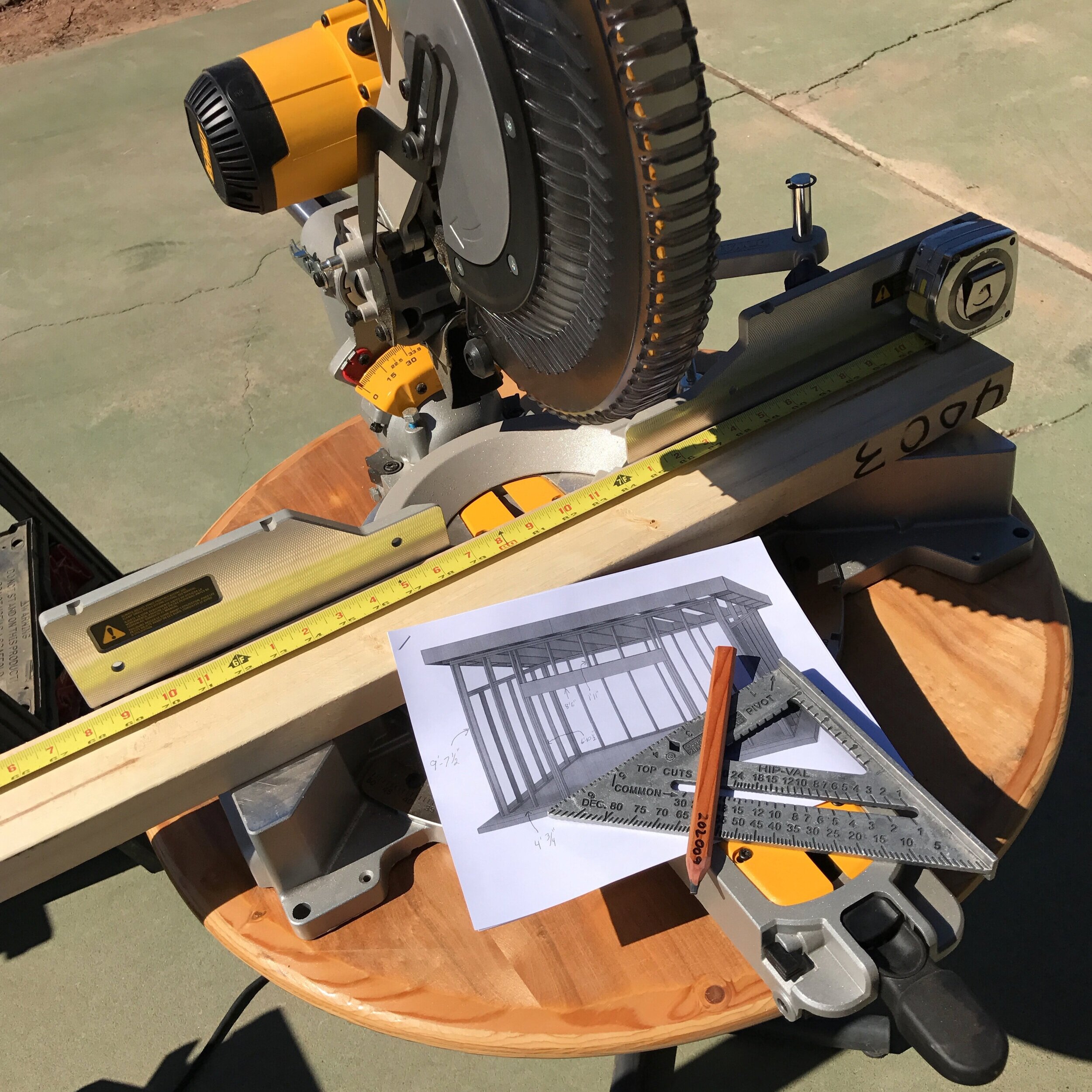 DeWalt miter saw, speed square, and plans
